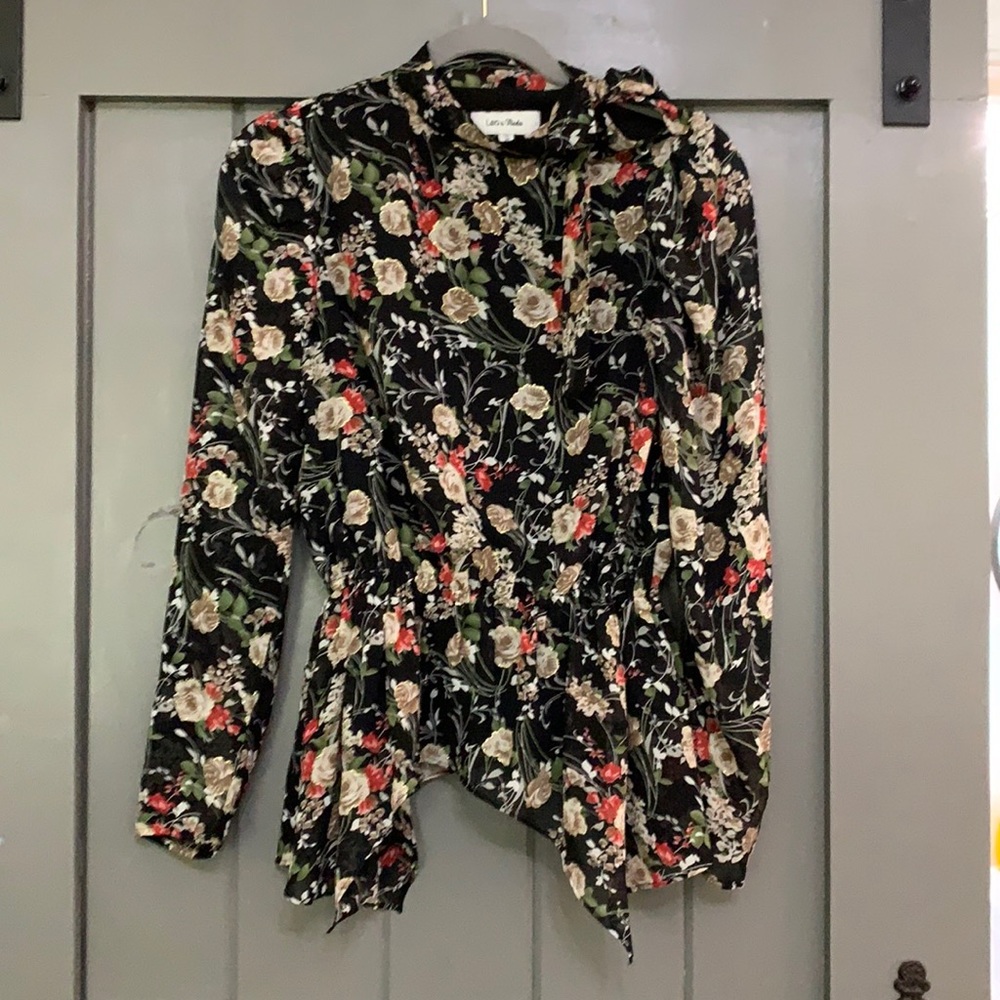 Floral top. Ties on upper left shoulder.